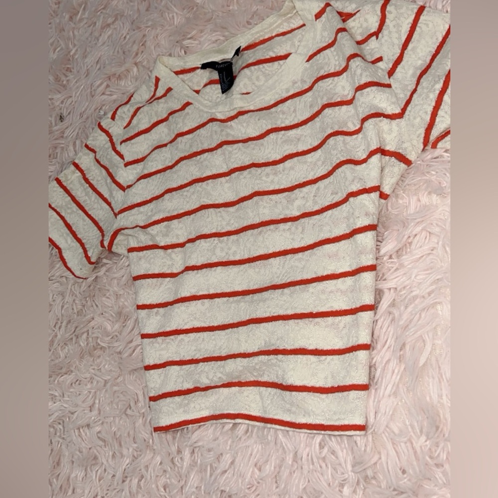 Medium white with orange striped crop top.